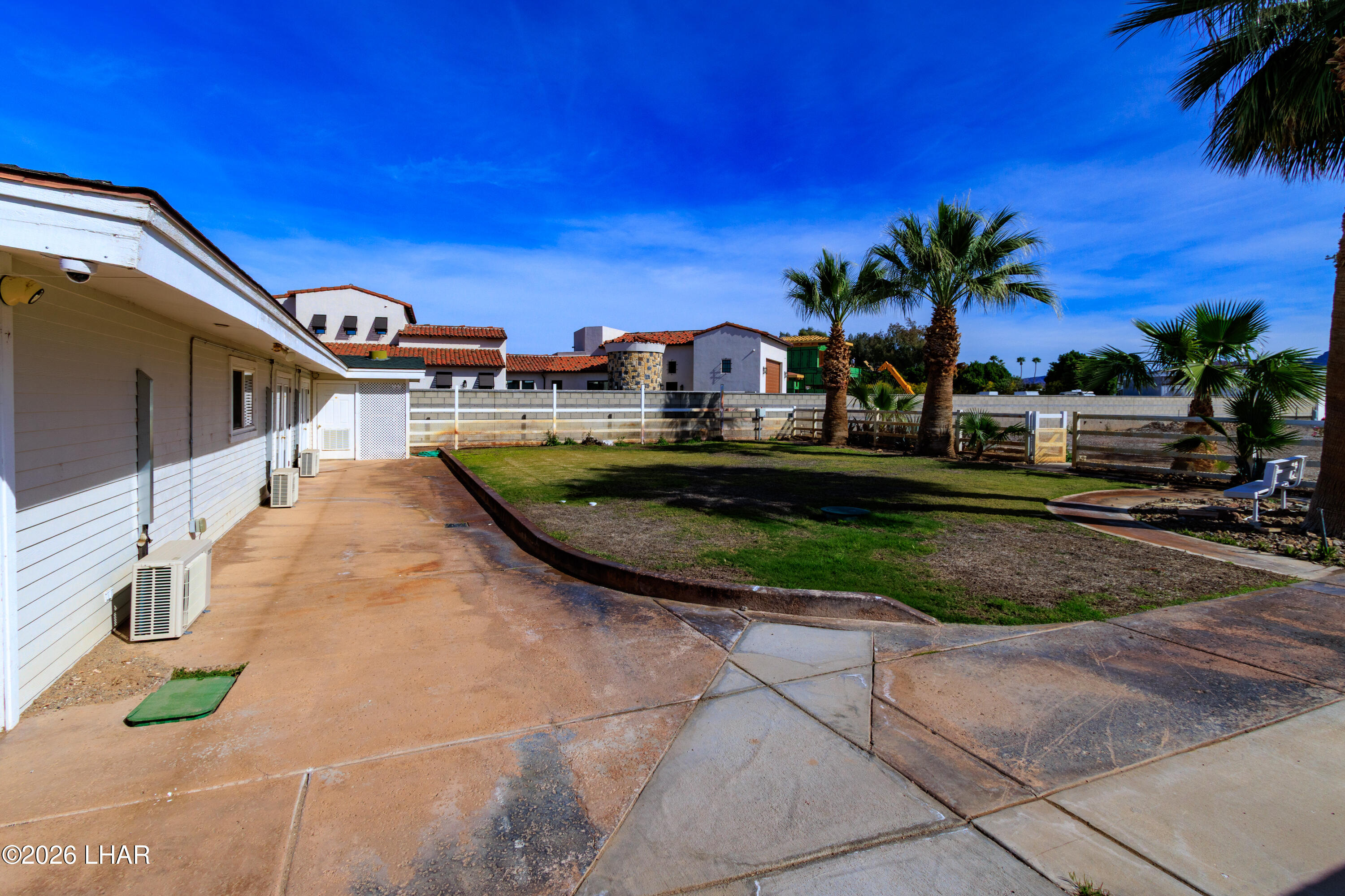 7870 Riverside Drive Parker, AZ 85344 - Photo 65 of 88 a view of a swimming pool with a garden and trees