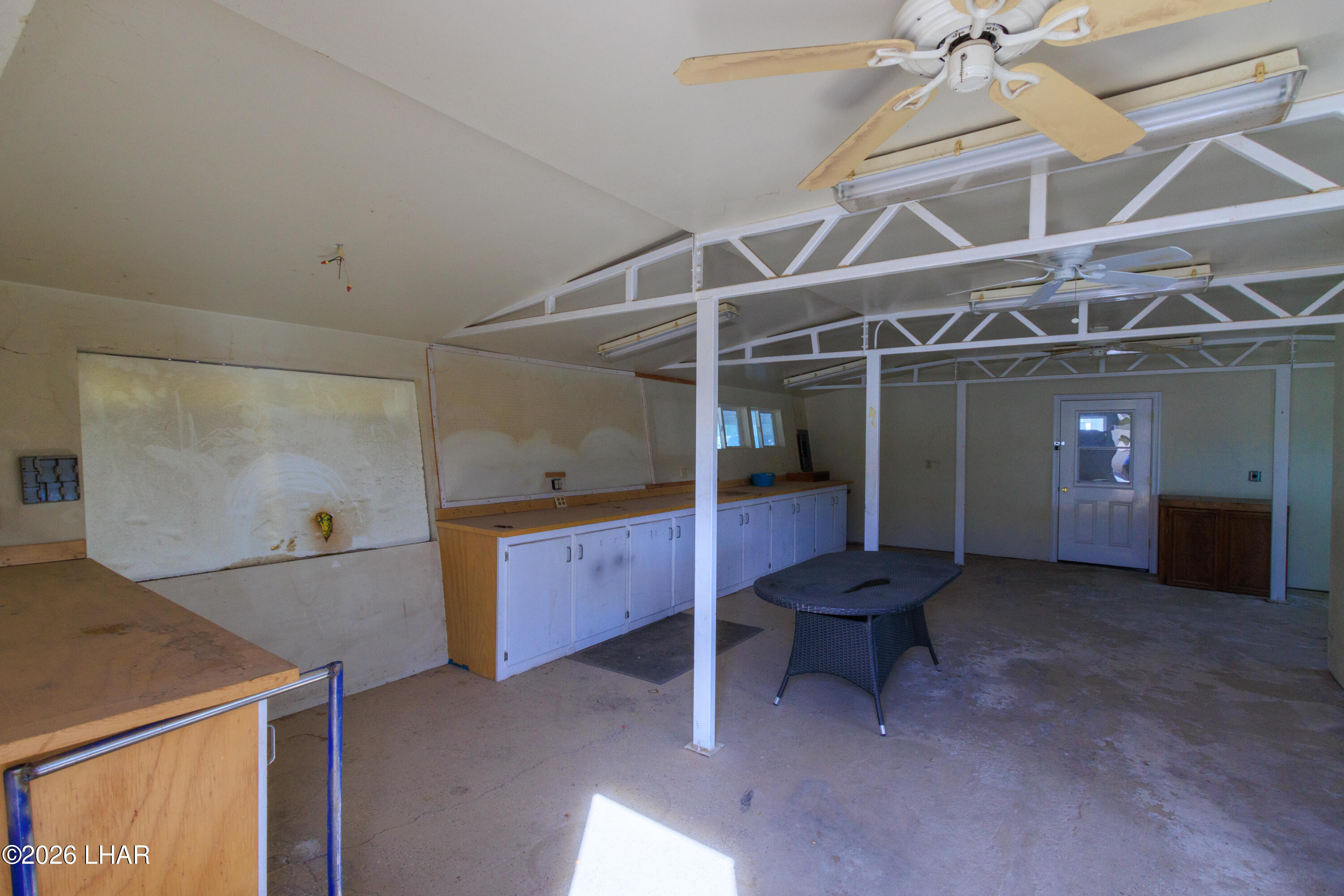 7870 Riverside Drive Parker, AZ 85344 - Photo 74 of 88 a living room with furniture and a chandelier