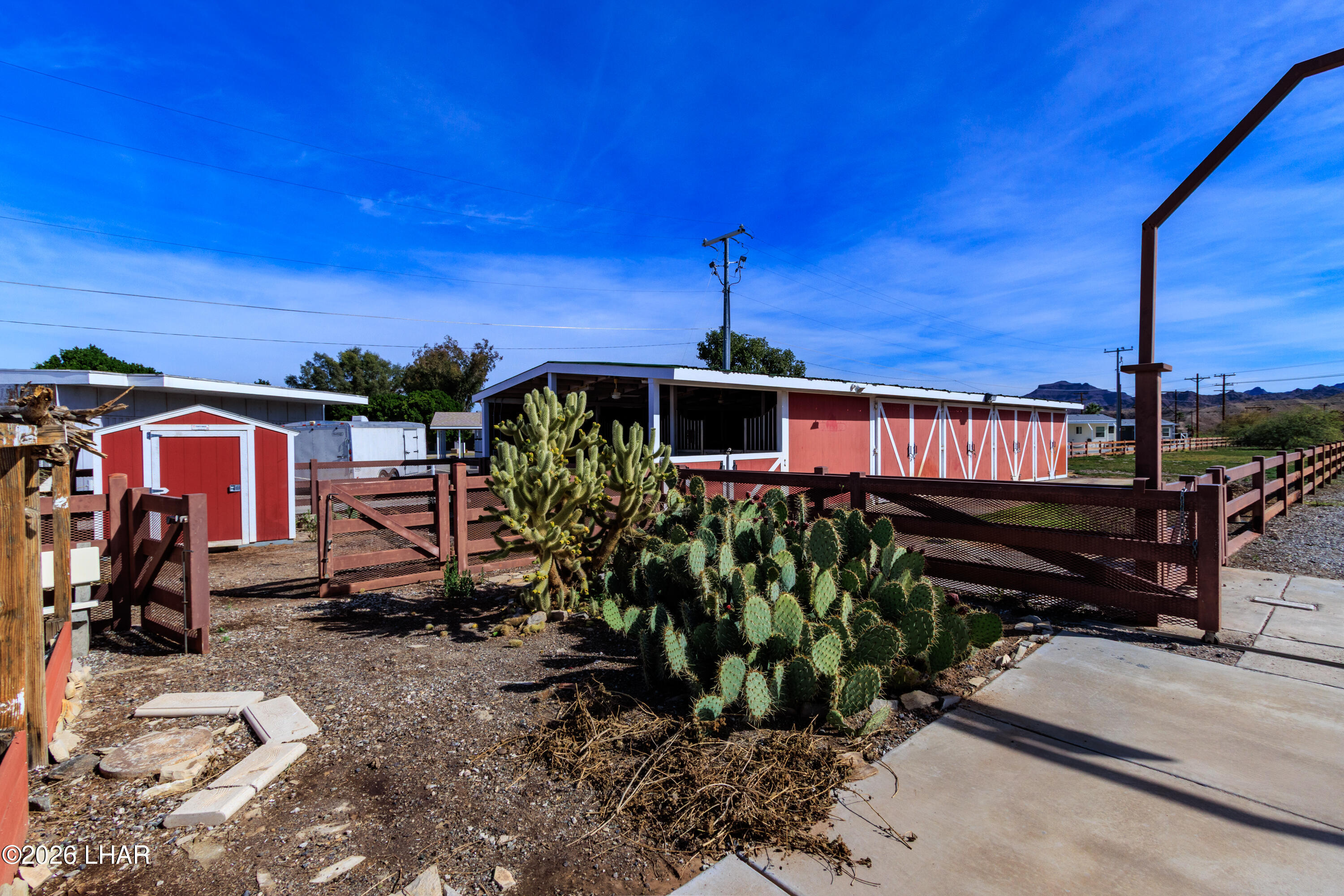 7870 Riverside Drive Parker, AZ 85344 - Photo 77 of 88 a front view of a house with garden