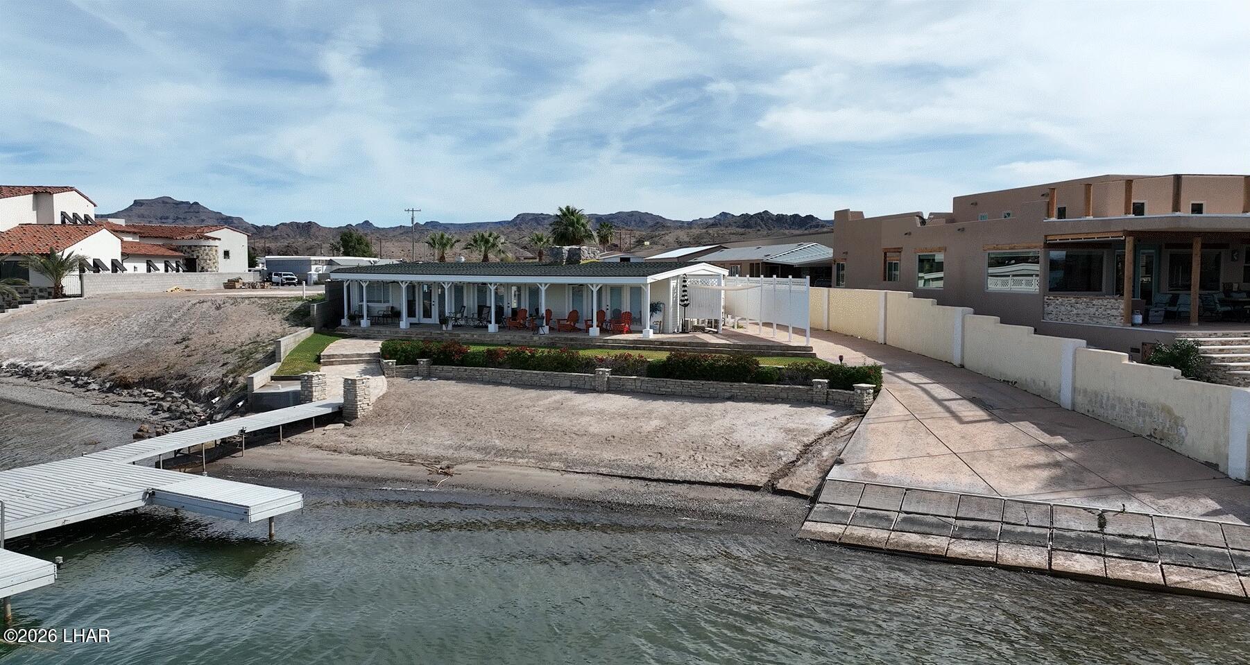 7870 Riverside Drive Parker, AZ 85344 - Photo 88 of 88 a view of a swimming pool with a lounge chairs