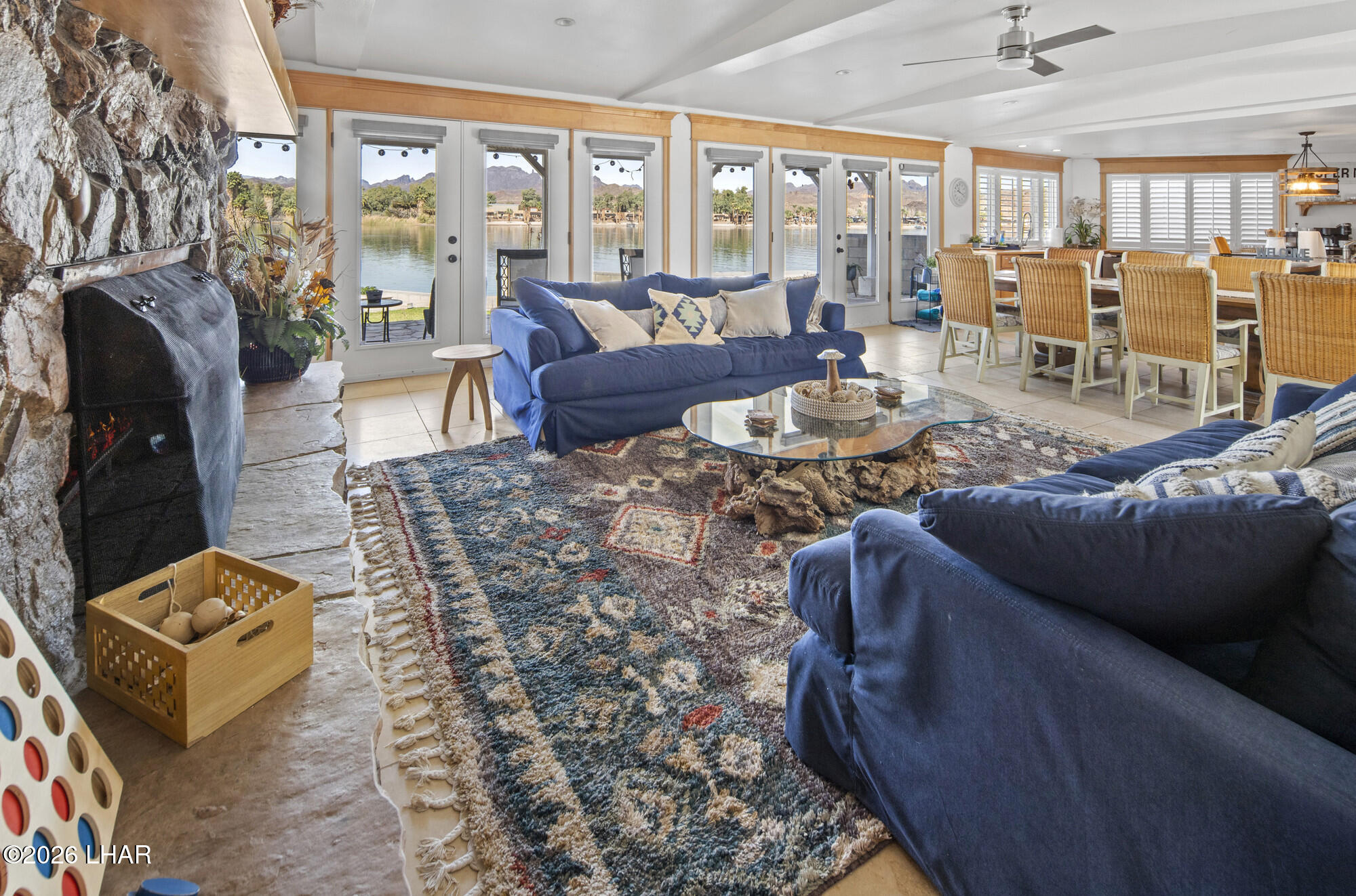 7870 Riverside Drive Parker, AZ 85344 - Photo 10 of 88 a living room with furniture and a floor to ceiling window