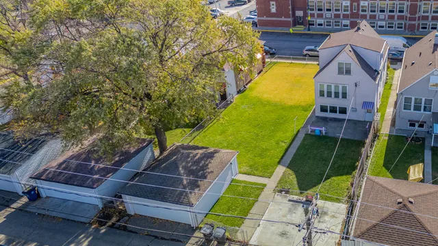 a view of swimming pool with a patio and a yard