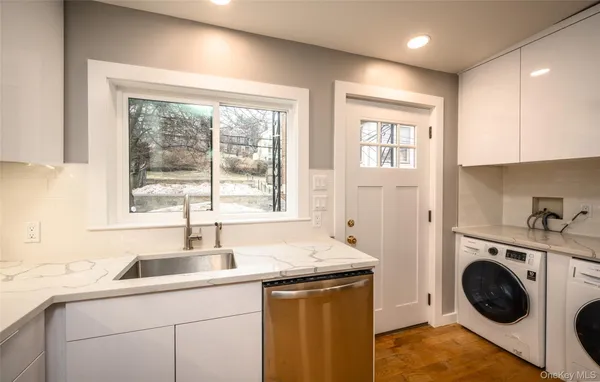 a kitchen with a sink and a window