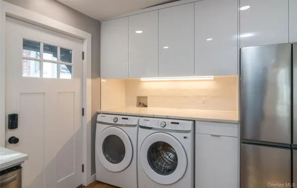 a view of a kitchen with washer and dryer