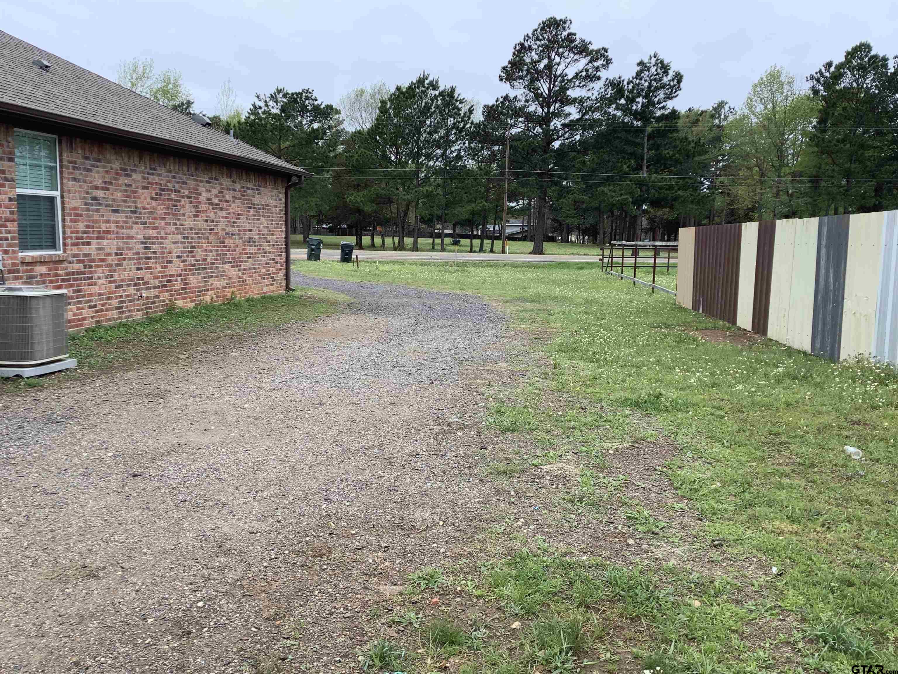 11621 FM 848 Tyler, TX 75707 - Photo 2 of 15 a backyard of a house with lots of green space