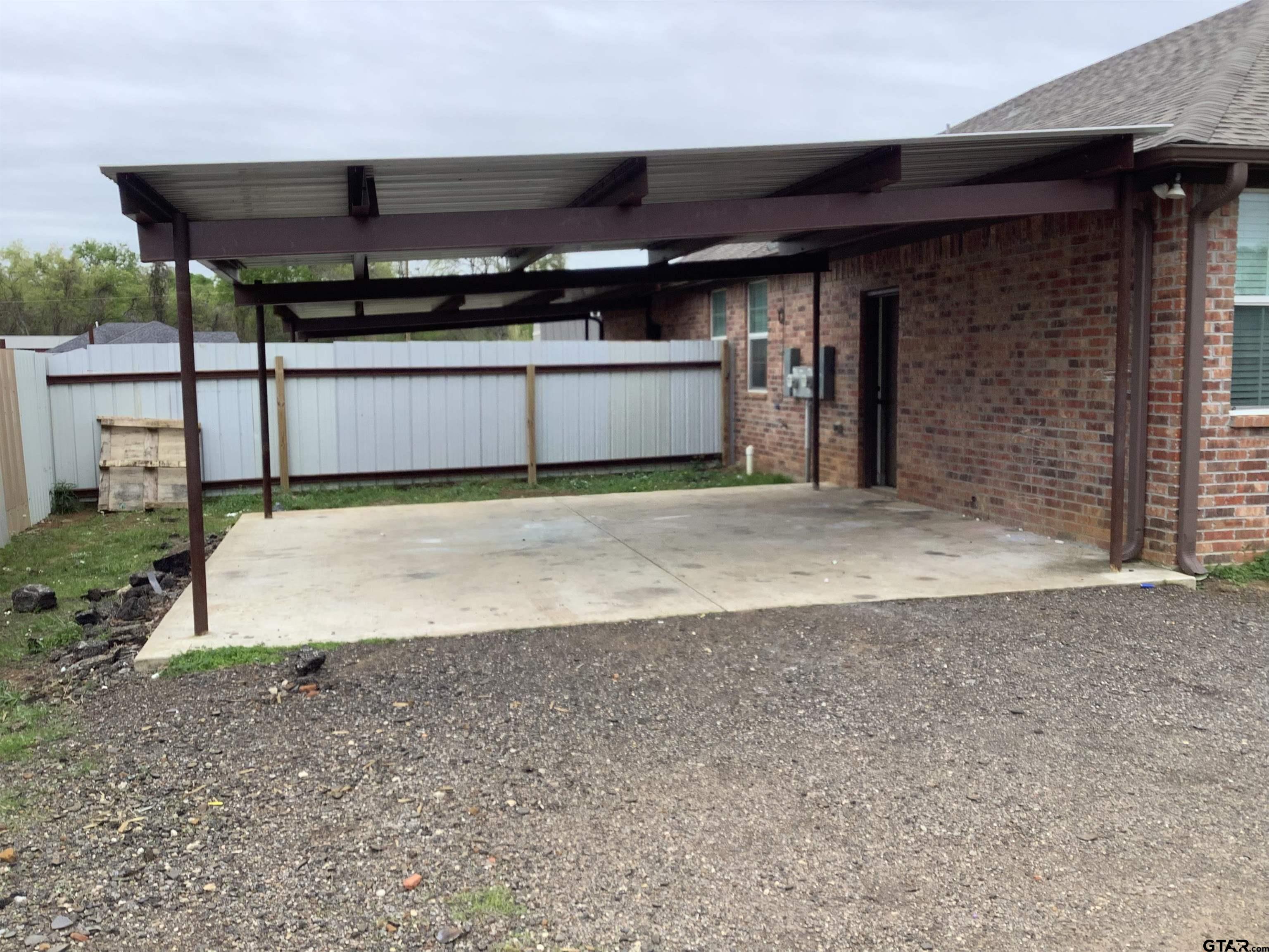 11621 FM 848 Tyler, TX 75707 - Photo 3 of 15 a view of a room with wooden walls