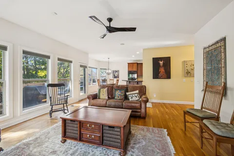 a living room with furniture and a table