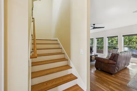 a view of entryway bedroom and hall with wooden floor