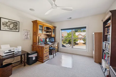 a view of room with window and furniture
