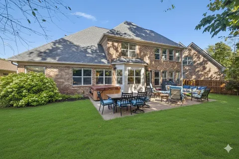 a view of a house with a yard porch and sitting area