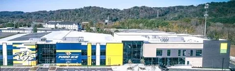 a view of houses with yard and mountain view in back