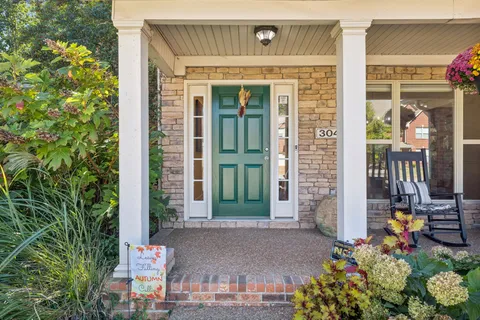 front view of a house with a potted plant