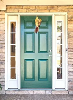 a view of a brick house with large windows