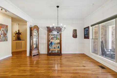 a view of a livingroom with furniture window and wooden floor
