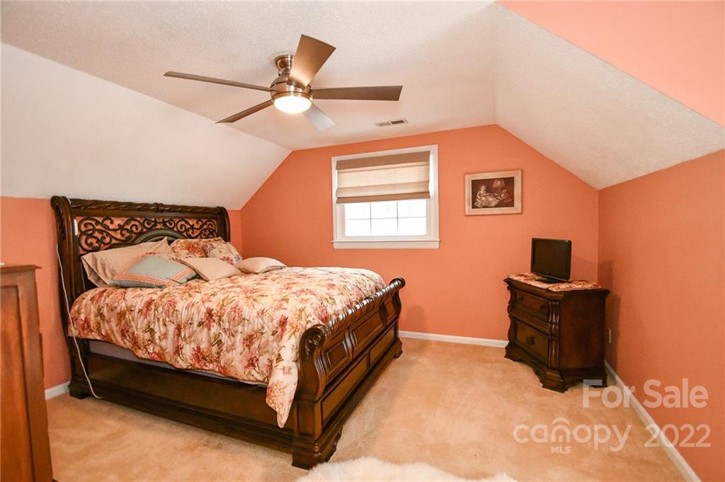 9101 Bartlett Road Mint Hill, NC 28227 - Photo 18 of 20 a bedroom with a bed and window