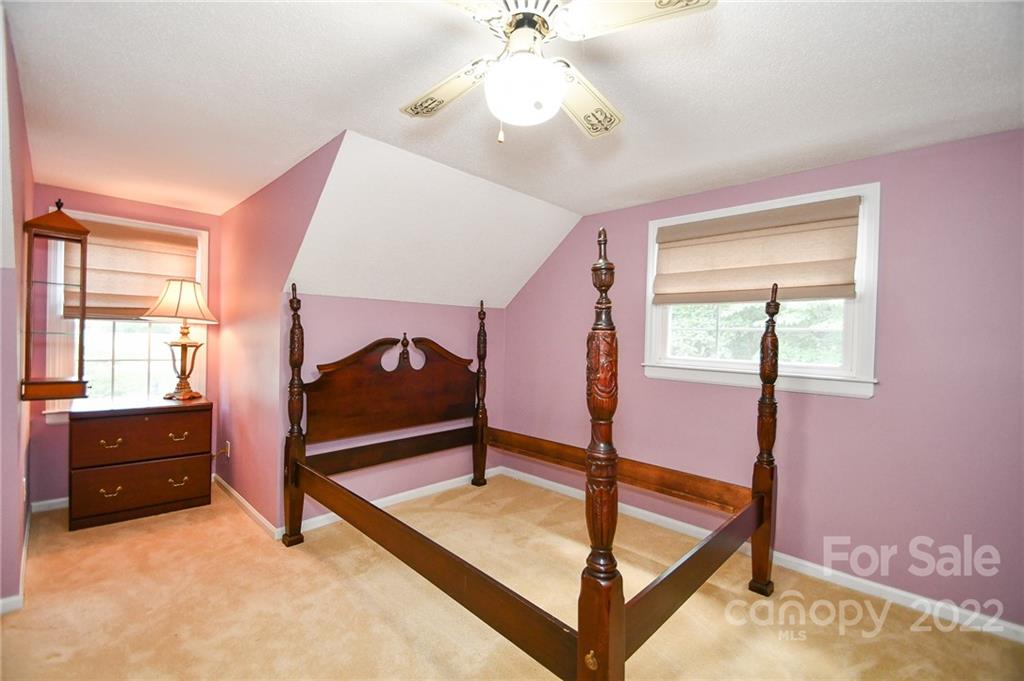 9101 Bartlett Road Mint Hill, NC 28227 - Photo 19 of 20 a bedroom with a bed and a dresser