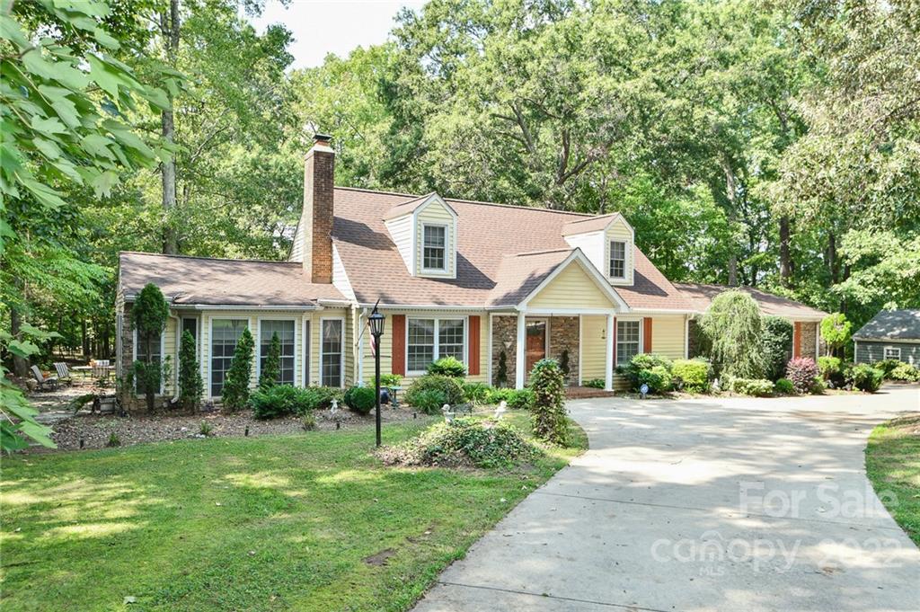 9101 Bartlett Road Mint Hill, NC 28227 - Photo 2 of 20 a front view of a house with a garden