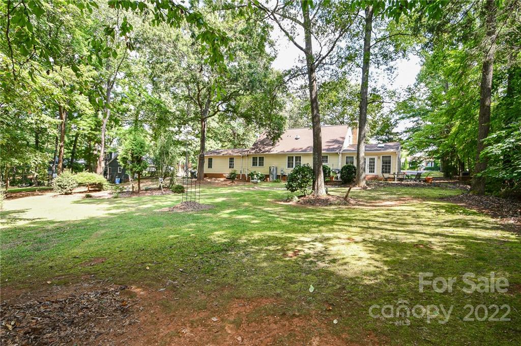 9101 Bartlett Road Mint Hill, NC 28227 - Photo 4 of 20 a view of yard with swimming pool and trees