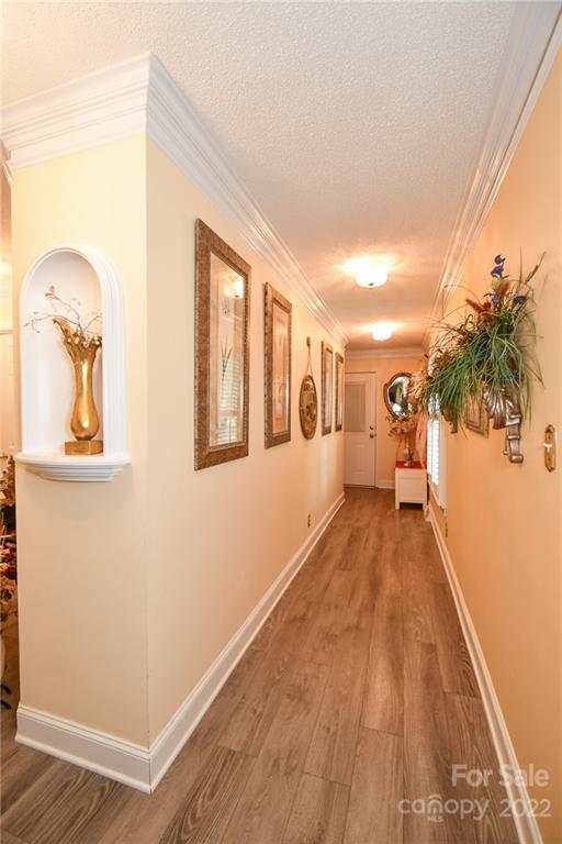 9101 Bartlett Road Mint Hill, NC 28227 - Photo 7 of 20 a view of a room with wooden floor and door