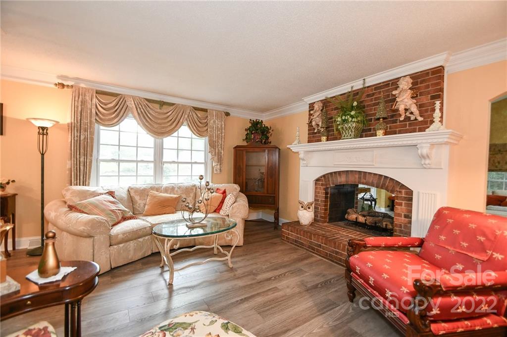 9101 Bartlett Road Mint Hill, NC 28227 - Photo 8 of 20 a living room with furniture and a fireplace