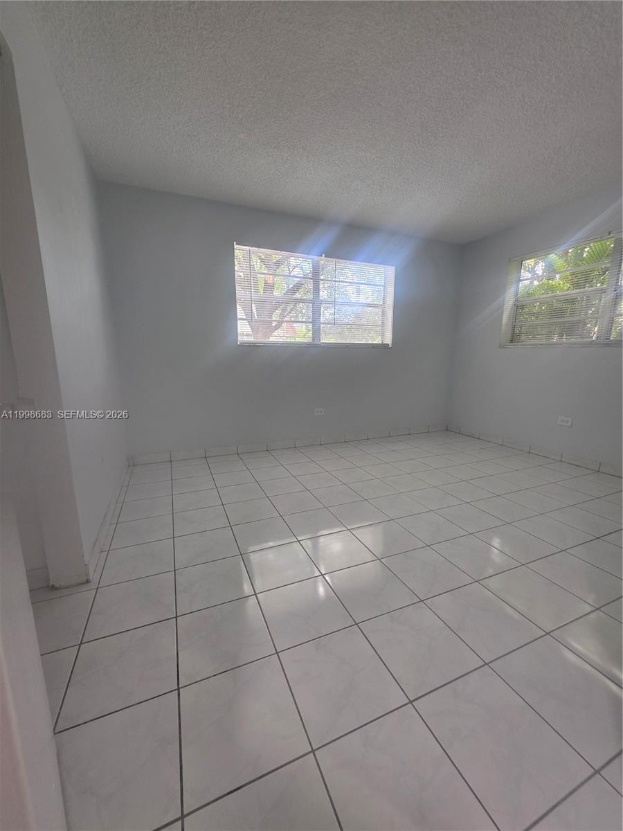 8101 Southwest 73rd Avenue, Unit 1 Miami, FL 33143 - Photo 34 of 52 a view of an empty room and a window