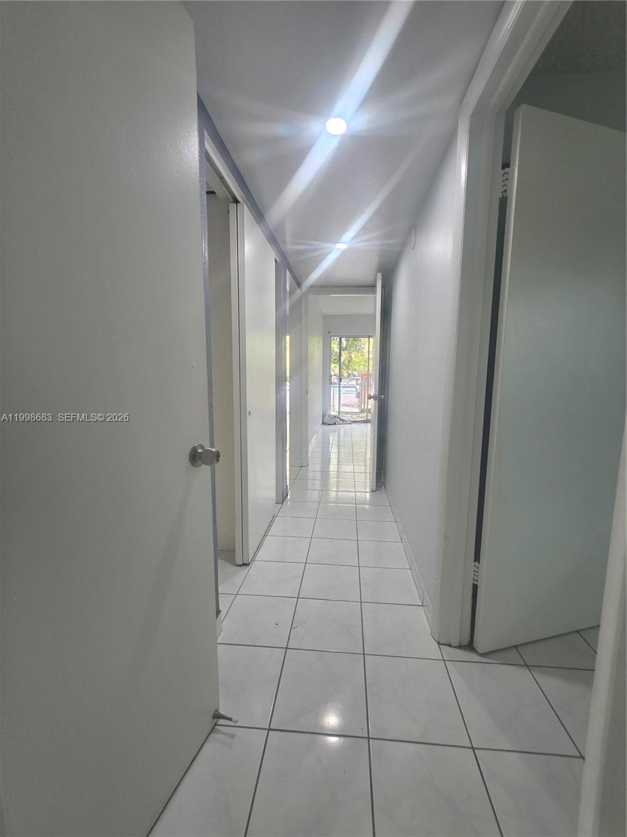 8101 Southwest 73rd Avenue, Unit 1 Miami, FL 33143 - Photo 35 of 52 a view of a hallway