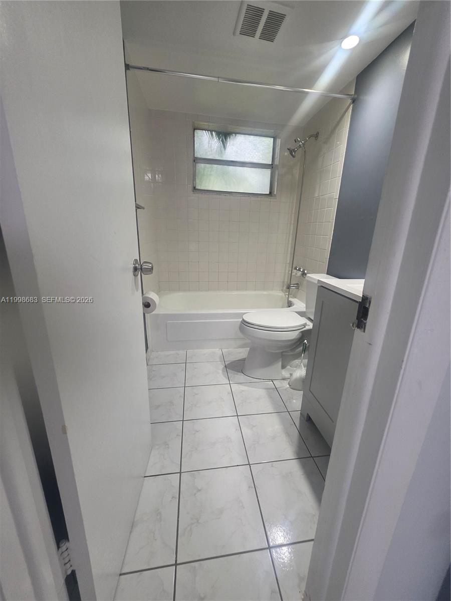 8101 Southwest 73rd Avenue, Unit 1 Miami, FL 33143 - Photo 42 of 52 a bathroom with a toilet and a shower