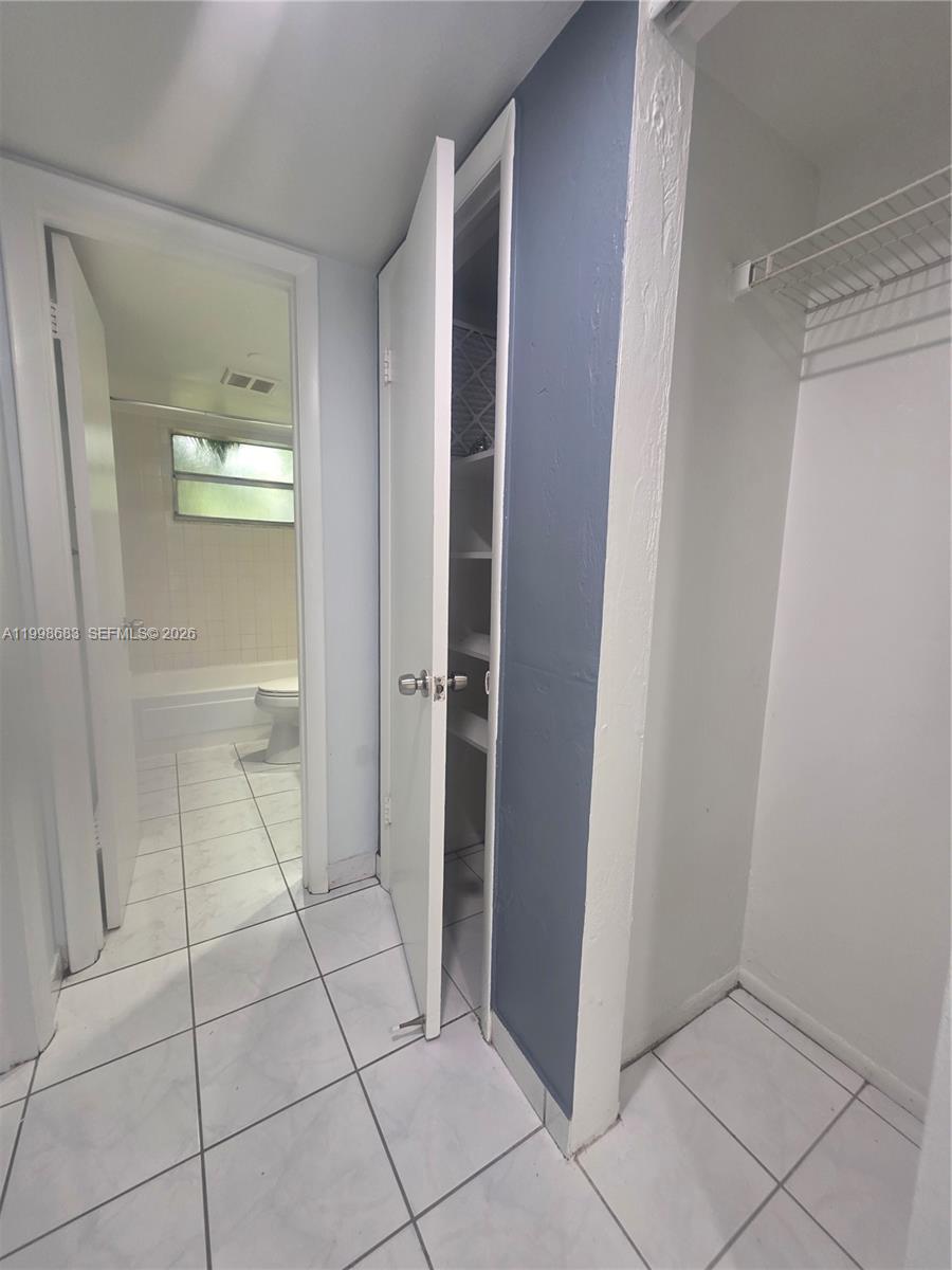 8101 Southwest 73rd Avenue, Unit 1 Miami, FL 33143 - Photo 43 of 52 a bathroom with a shower and a toilet