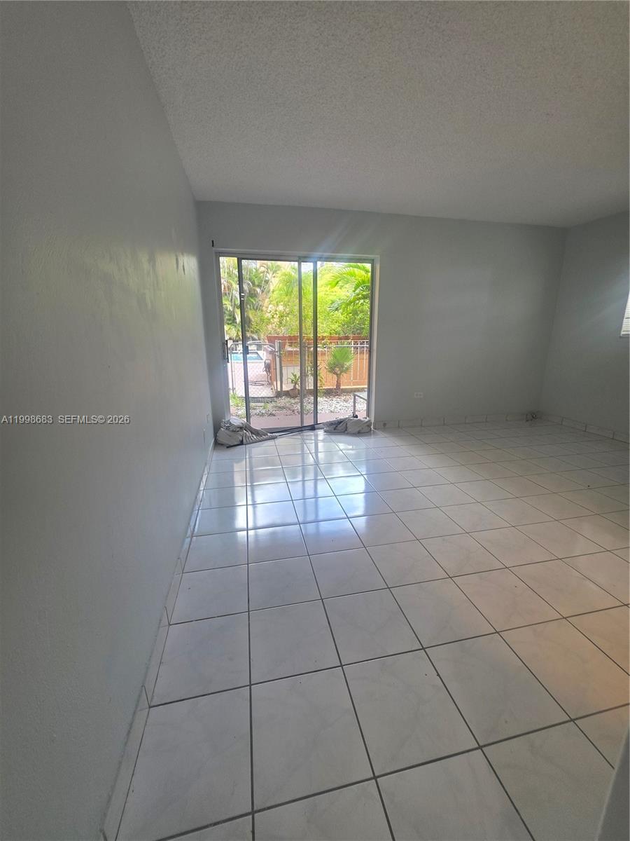 8101 Southwest 73rd Avenue, Unit 1 Miami, FL 33143 - Photo 44 of 52 a view of an empty room with a window