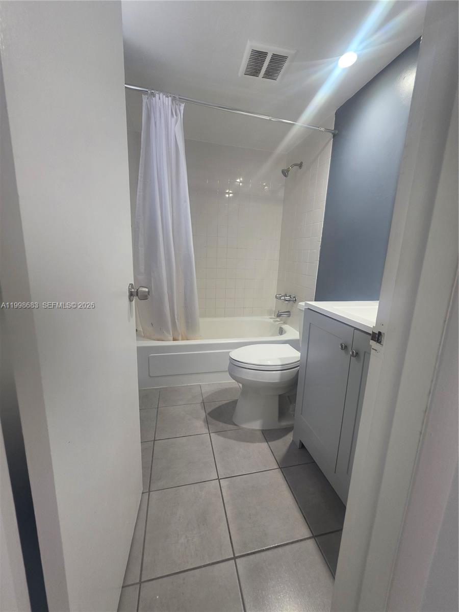 8101 Southwest 73rd Avenue, Unit 1 Miami, FL 33143 - Photo 46 of 52 a bathroom with a toilet and a shower