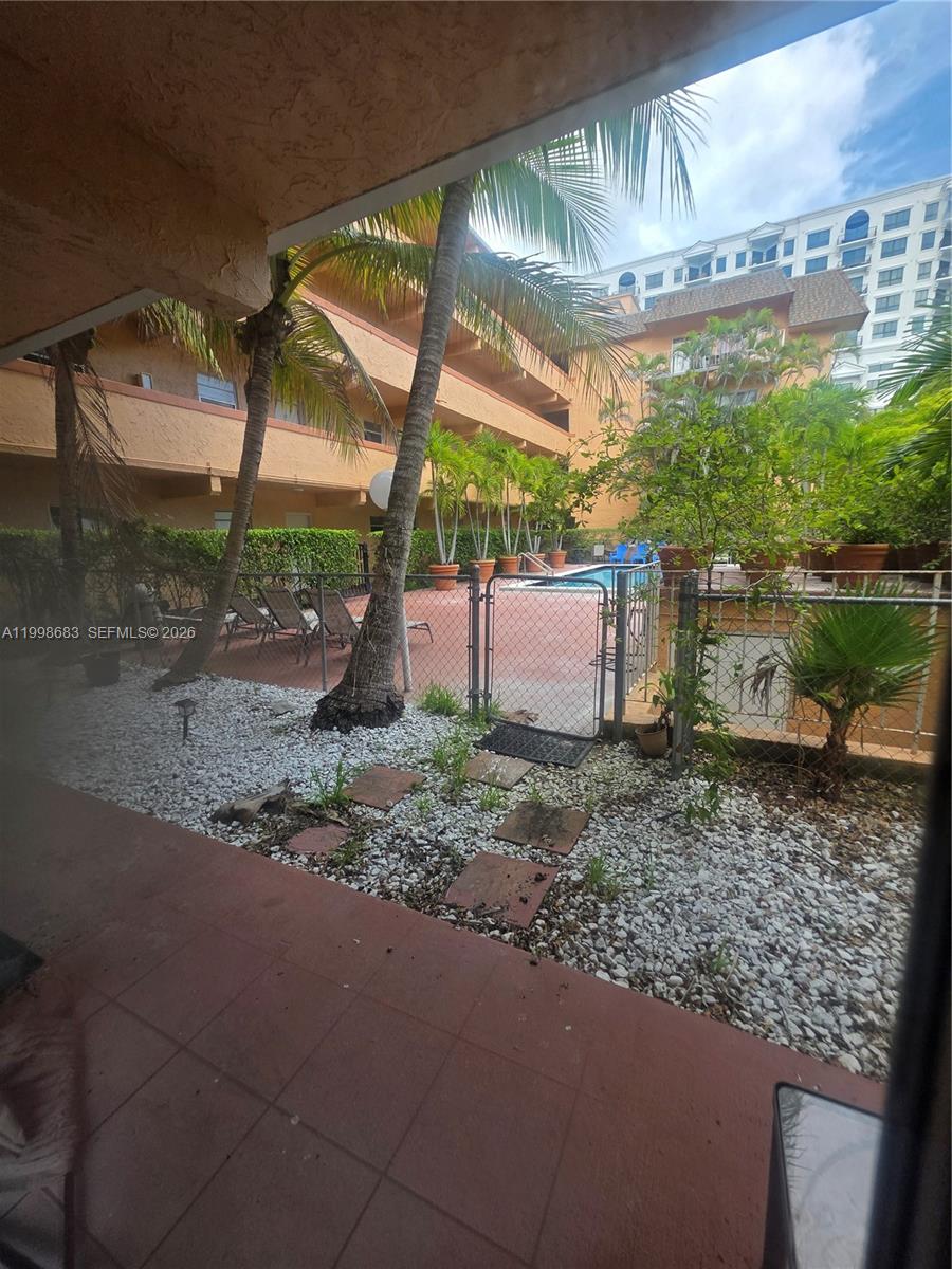 8101 Southwest 73rd Avenue, Unit 1 Miami, FL 33143 - Photo 47 of 52 a backyard of a house with a garden and barbeque oven