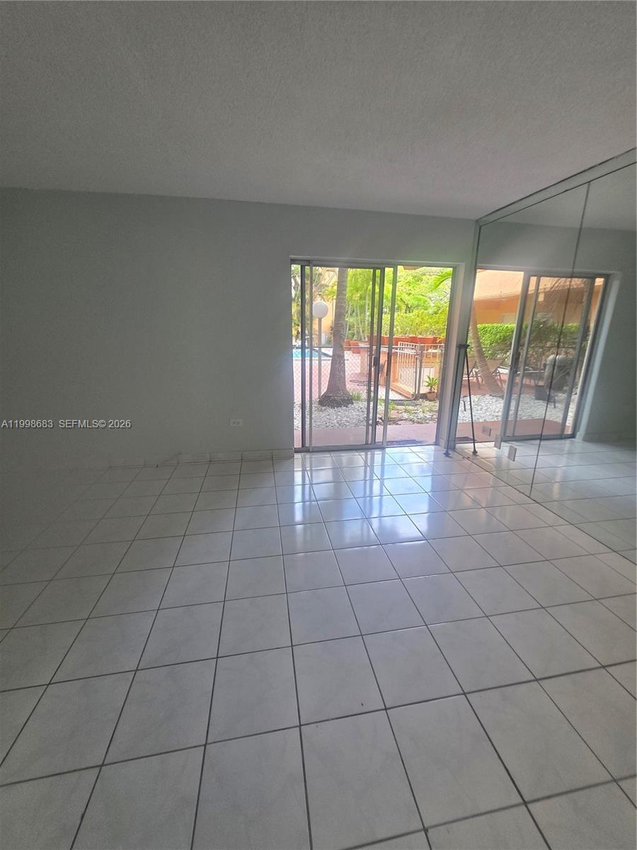 8101 Southwest 73rd Avenue, Unit 1 Miami, FL 33143 - Photo 48 of 52 a view of an empty room and window