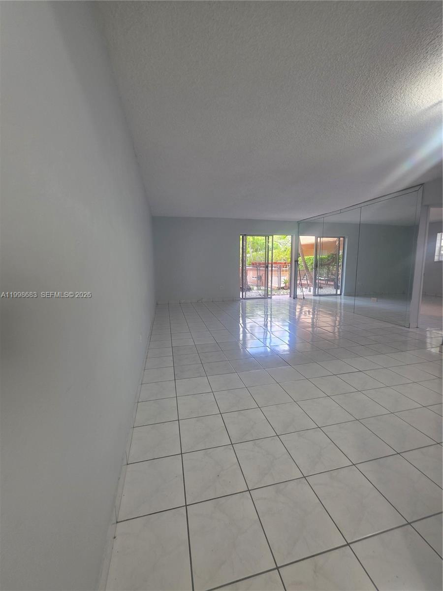 8101 Southwest 73rd Avenue, Unit 1 Miami, FL 33143 - Photo 49 of 52 an empty room with windows