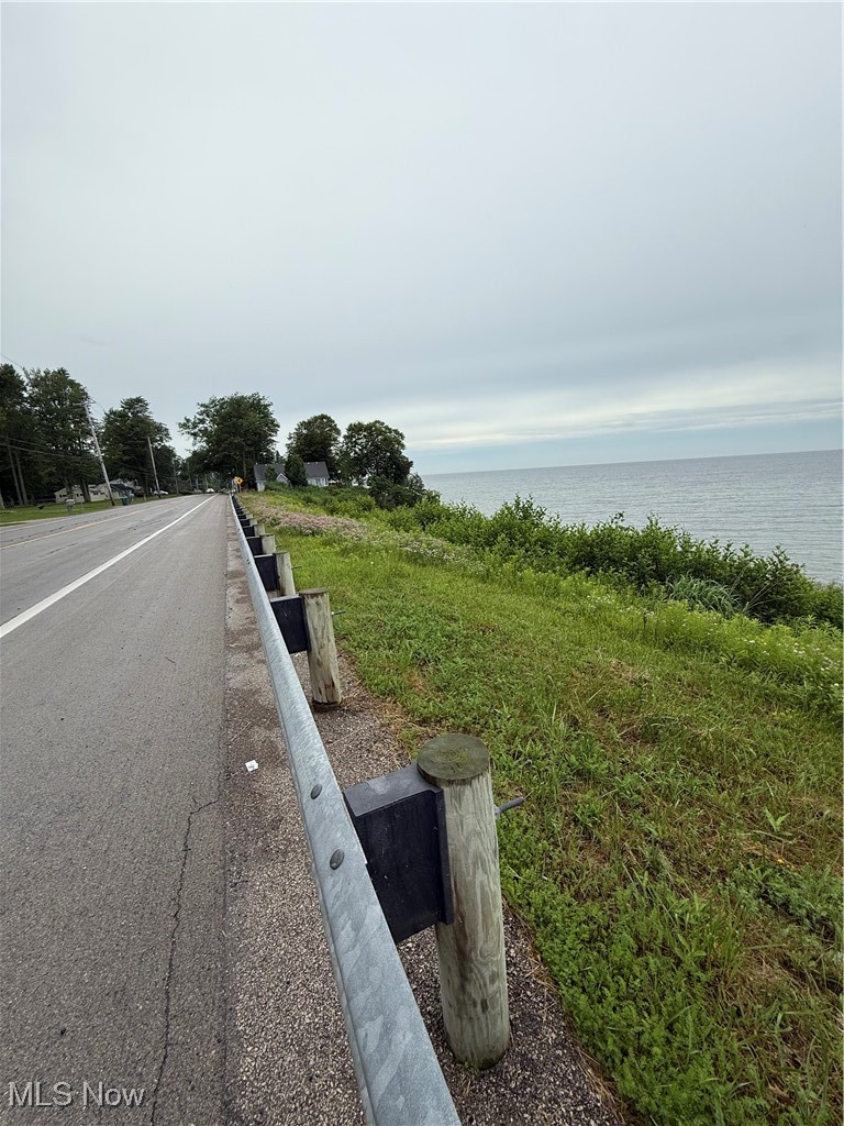 4394 Lake Road East Geneva, OH 44041 - Photo 9 of 13 View of asphalt road with a water view