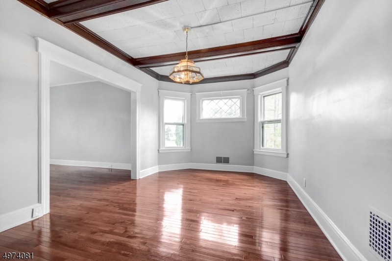 558 Summit Avenue, Unit 1 Westfield, NJ 07090 - Photo 9 of 13 a view of empty room with wooden floor and fan