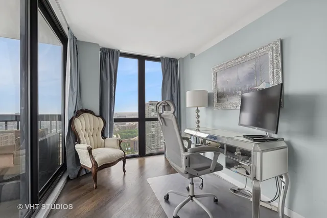 a work room with furniture and wooden floor