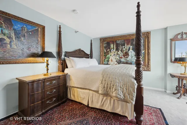 a bedroom with a bed dresser and a window