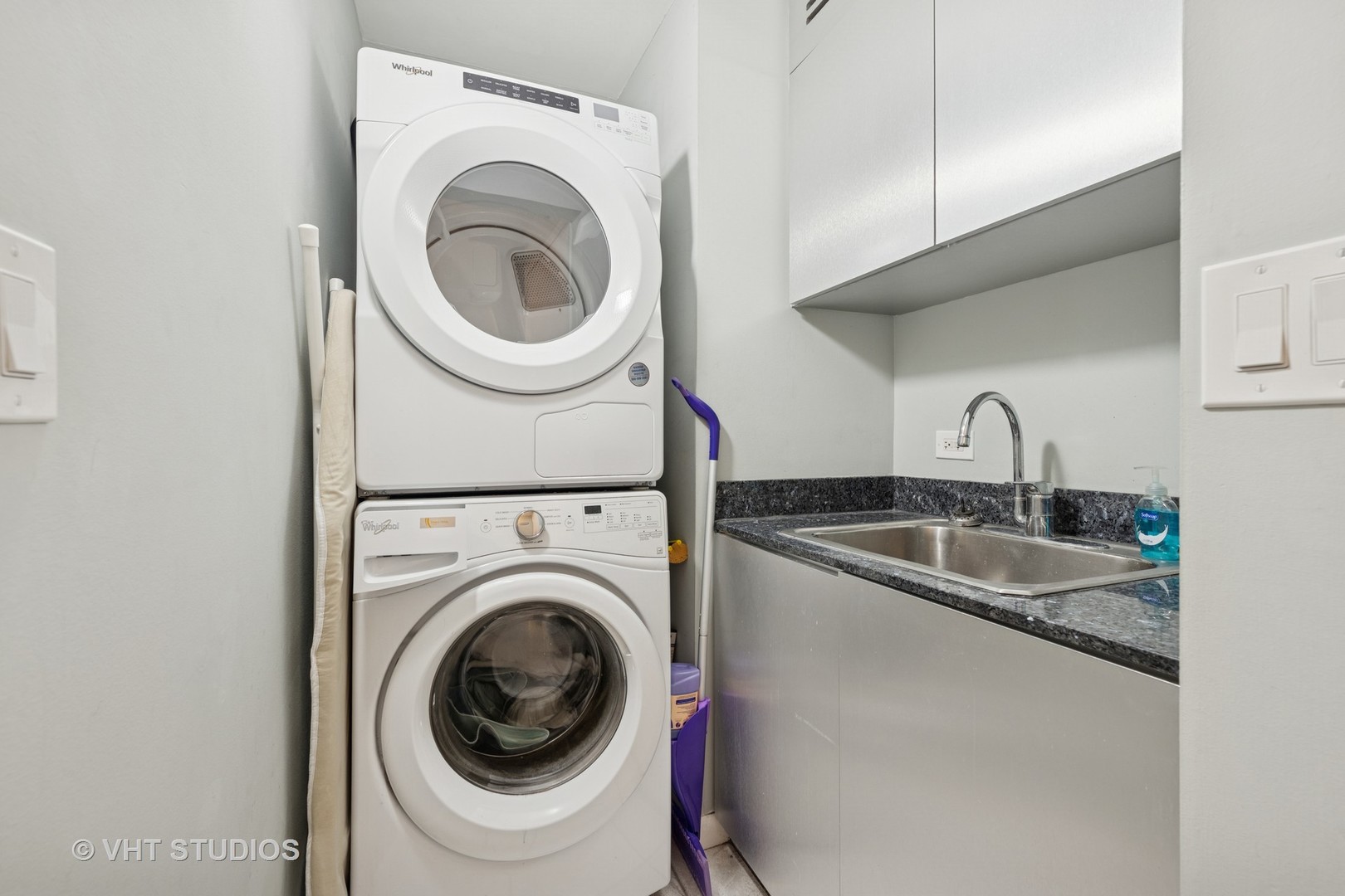 1122 North Clark Street, Unit 330110 Chicago, IL 60610 - Photo 21 of 22 a utility room with sink dryer and washer