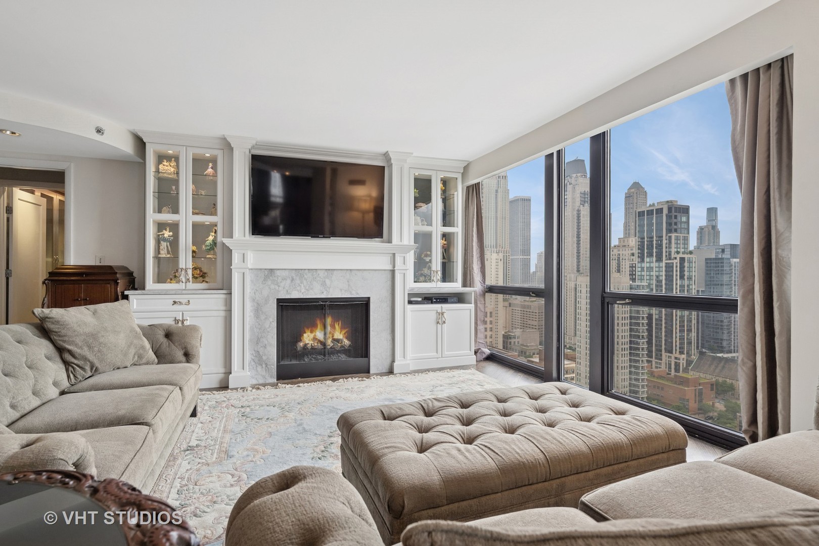 1122 North Clark Street, Unit 330110 Chicago, IL 60610 - Photo 4 of 22 a bedroom with furniture and a fireplace