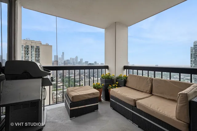 a living room with furniture and a floor to ceiling window