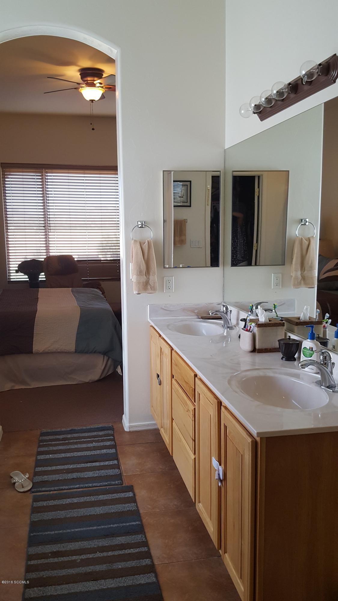 304 Circulo Bellagio Rio Rico, AZ 85648 - Photo 9 of 19 a bathroom with a sink and a mirror