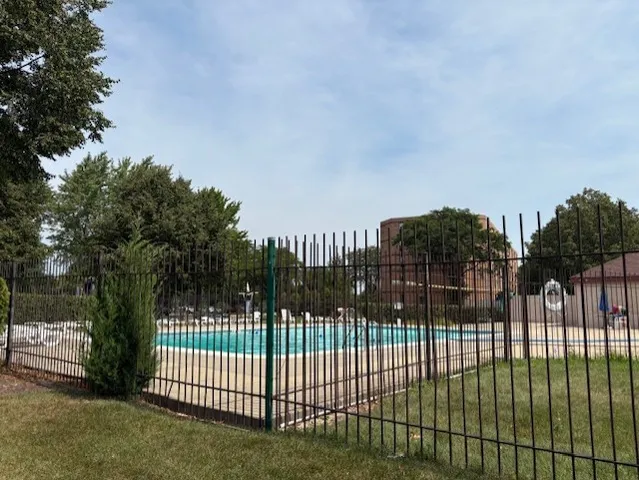 a view of a gate and fence
