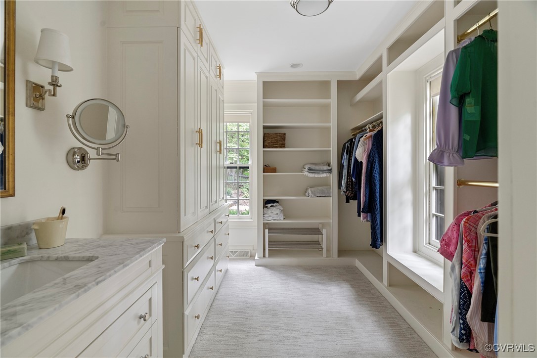 10700 Darby Circle Midlothian, VA 23113 - Photo 29 of 50 a bathroom with a granite countertop sink a mirror and shower