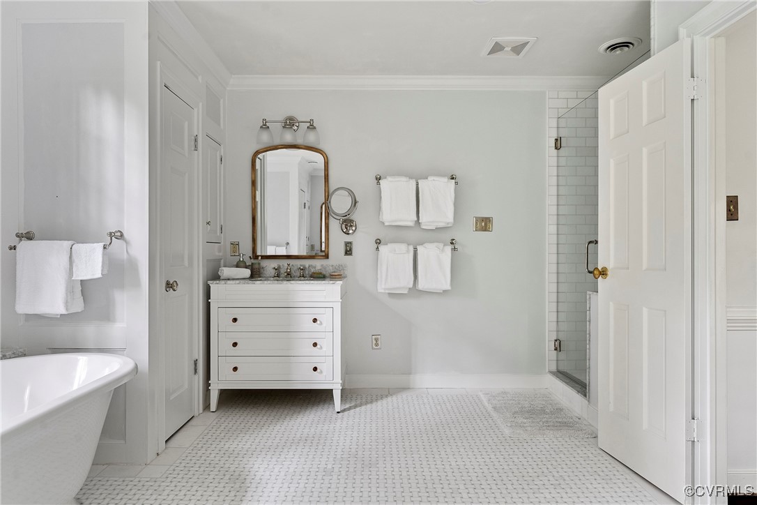 10700 Darby Circle Midlothian, VA 23113 - Photo 34 of 50 a bathroom with a double vanity sink a mirror and a bathtub