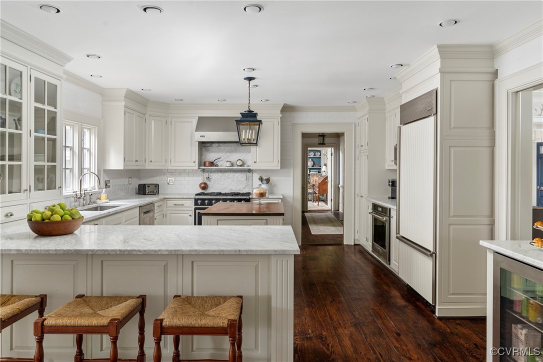 10700 Darby Circle Midlothian, VA 23113 - Photo 6 of 50 a kitchen with stainless steel appliances granite countertop a refrigerator a sink a stove and white cabinets