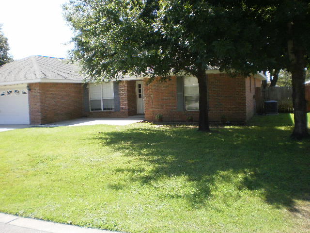 27 Beacon Way Santa Rosa Beach, FL 32459 - Photo 1 of 22 a backyard of a house with lots of green space and garden