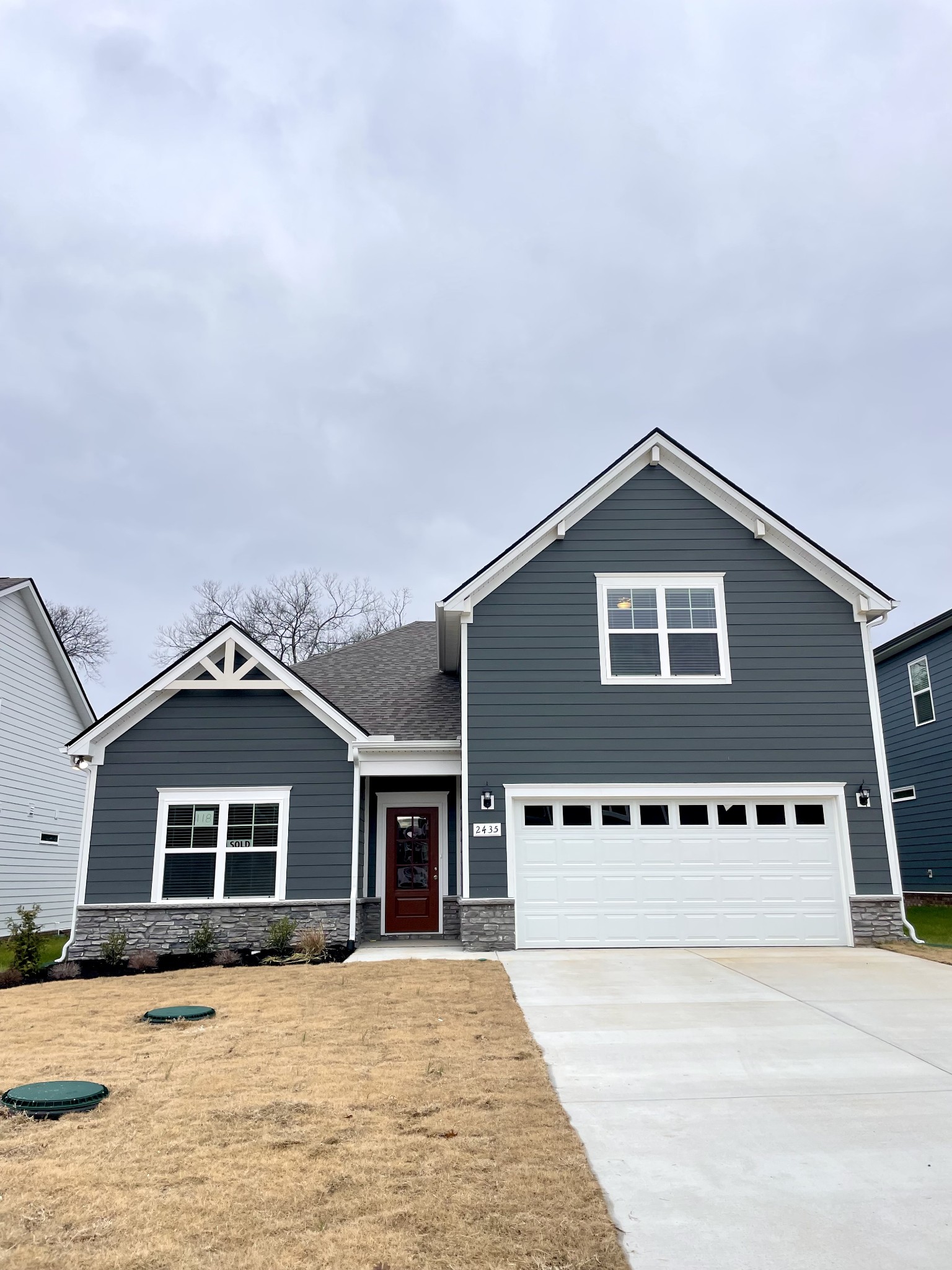 a front view of a house with yard