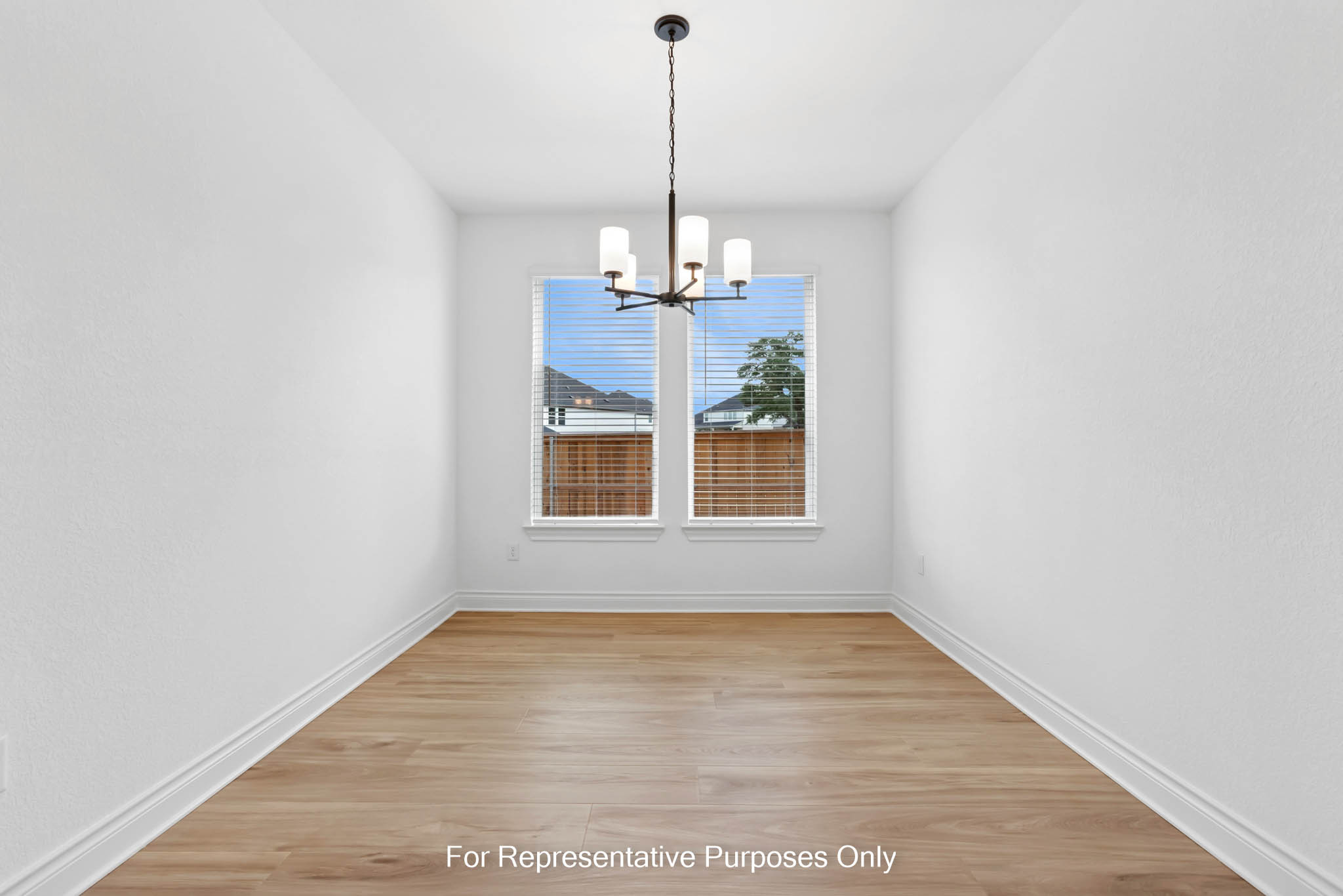 3721 Helena Way Leander, TX 78641 - Photo 3 of 15 a view of a room with wooden floor chandelier and a window