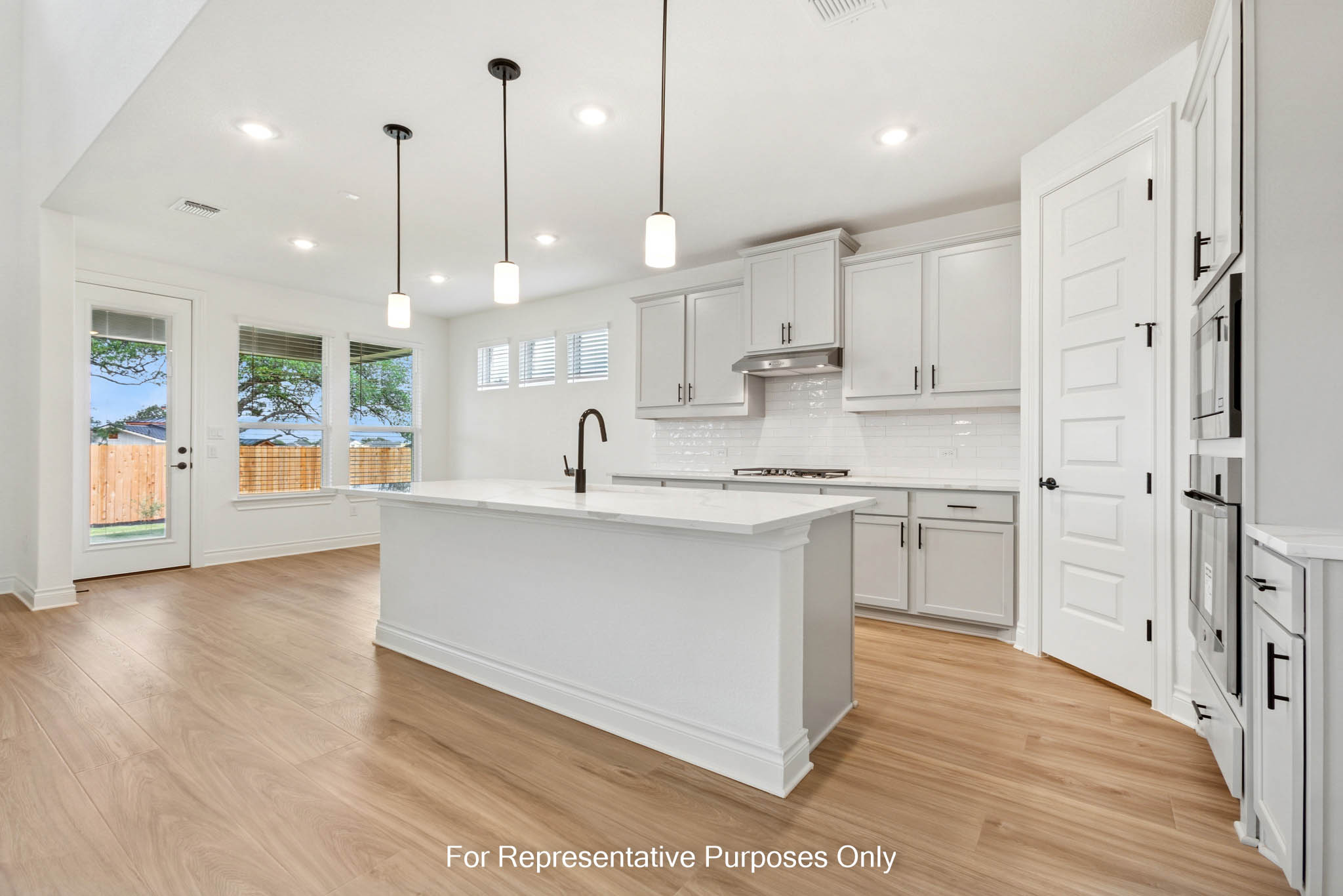3721 Helena Way Leander, TX 78641 - Photo 6 of 15 a kitchen with white cabinets and window