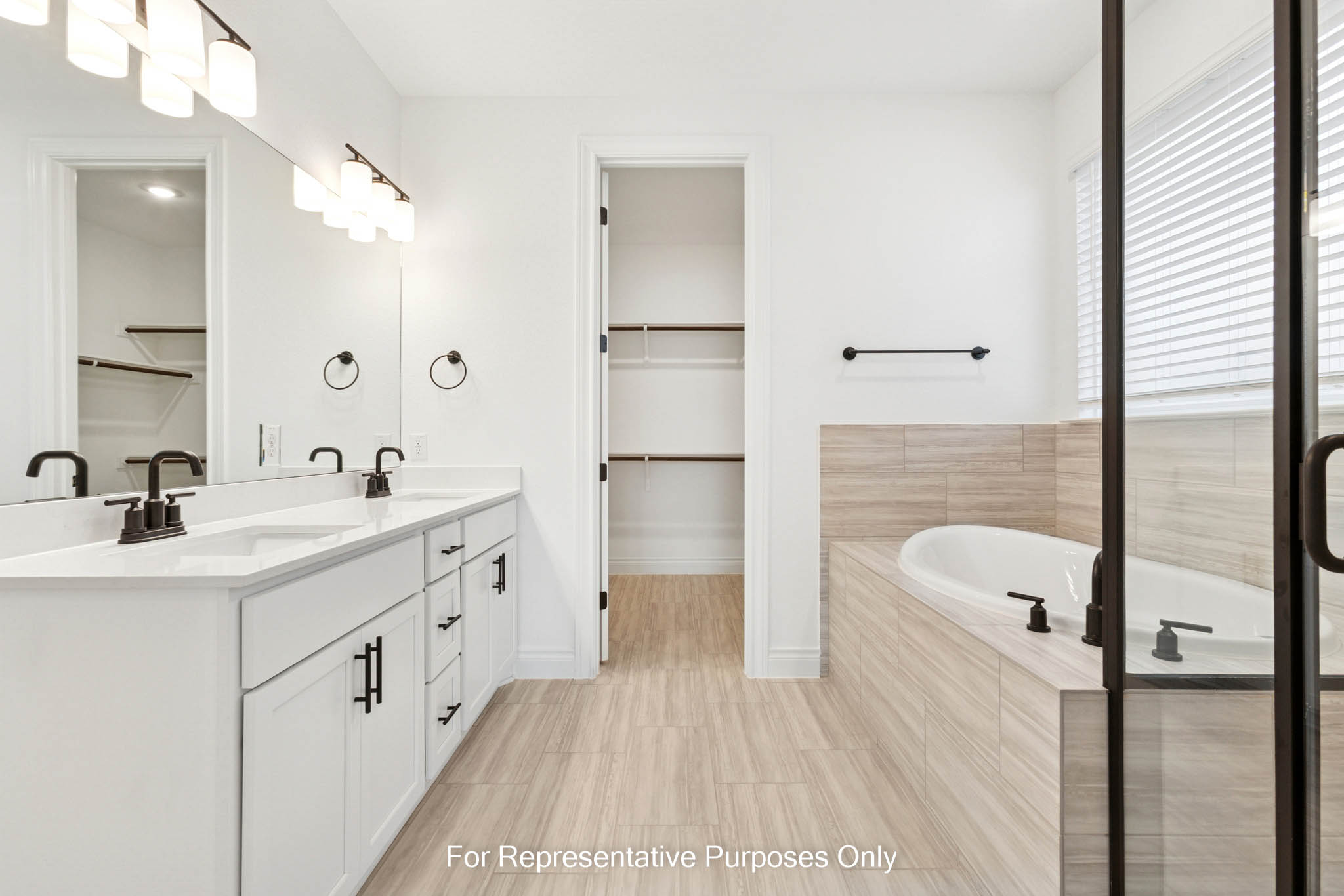 3721 Helena Way Leander, TX 78641 - Photo 10 of 15 a spacious bathroom with a double vanity sink a mirror and a bathtub